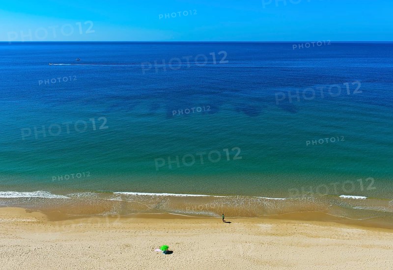 Empty sandy beach on the Algarve coast near Praia da Luz