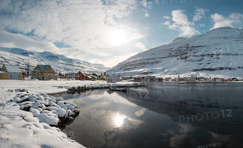 View over the village Seyoisfjorour with snow