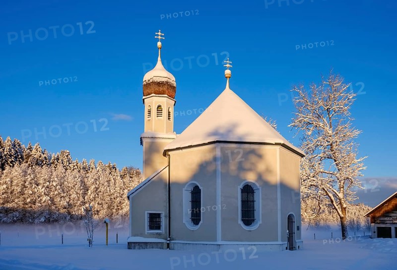 Snow-covered Nikolauskapelle in the morning light