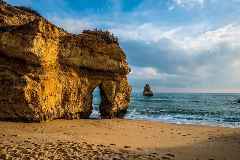 Rocky coast with beach and red rocks