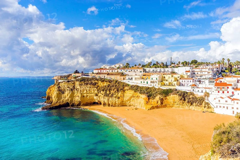 Wide sandy beach and white architecture of charming Carvoeiro