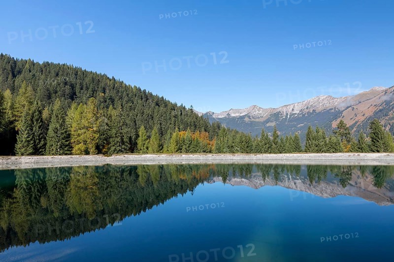 Water reservoir for snow production for the ski slopes on Grubigstein with view to Daniel