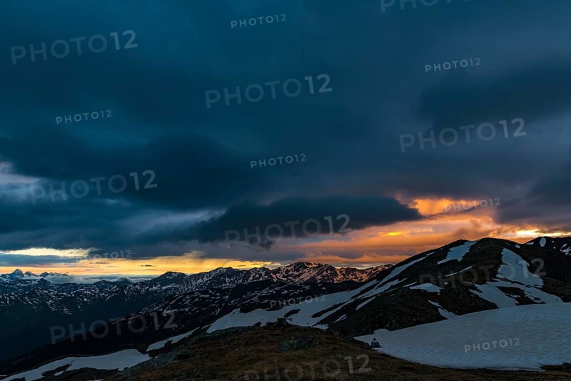 Sunrise over South Tyrolean mountains with dramatic clouds