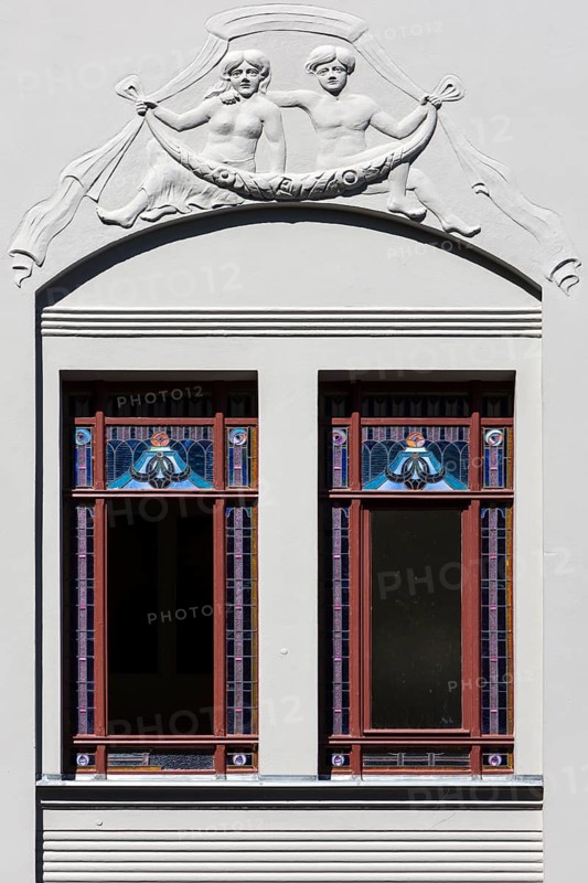 Relief and stained-glass windows on a town house