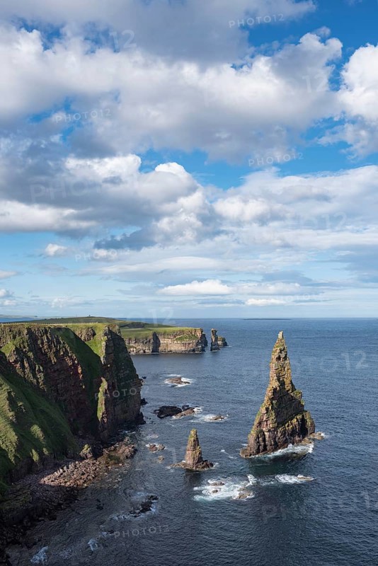 Rugged coastal landscape with the rock spikes Duncansby Stacks