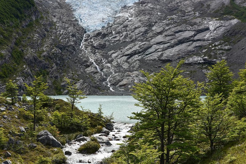 Melting glacier with lake and forest