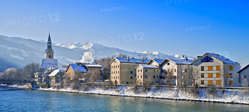 Row of houses with hospital church on the Inn in winter