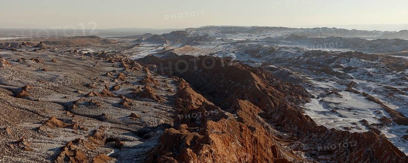 Bizarre red rock formations with white salt