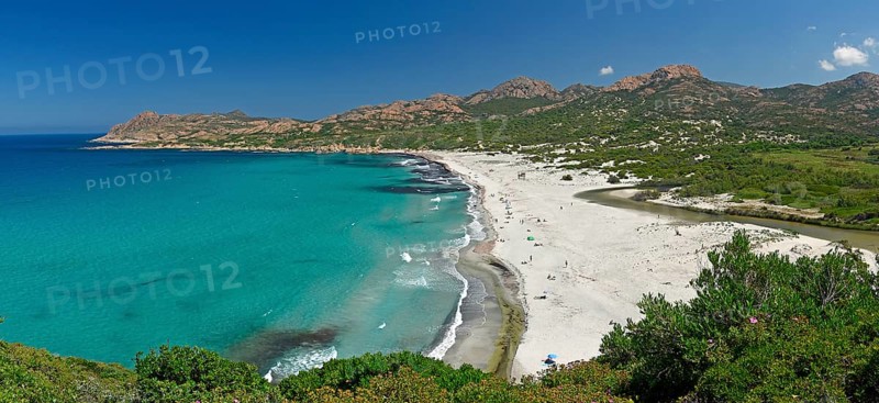 Turquoise-blue water on the sandy beach of Ostriconi