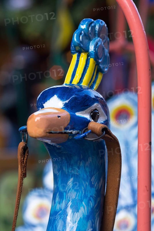 Peacock head of a nostalgic children's carousel