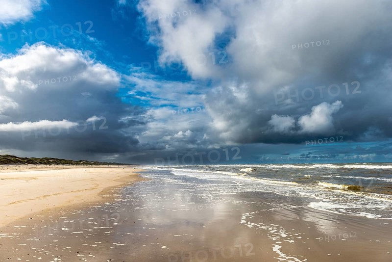 Dramatic rain clouds on the North Sea beach