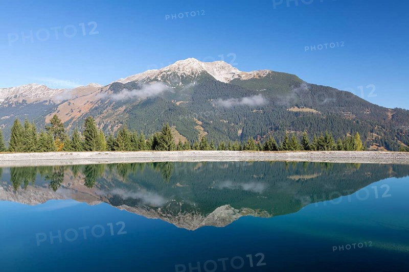 Water reservoir for snow production for the ski slopes on Grubigstein with view to Daniel