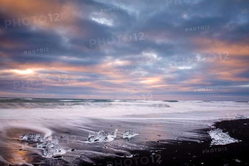 Ice, chunks of ice on lava beach near Jokulsarlon