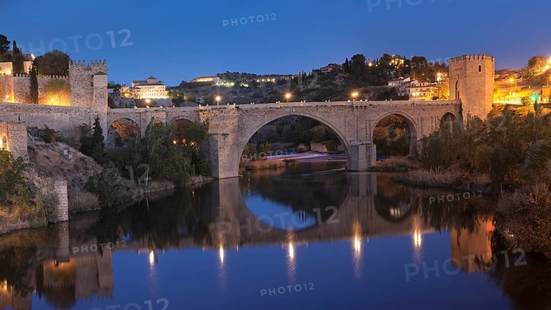 Puente de San Martin bridge reflected in the Tajo River
