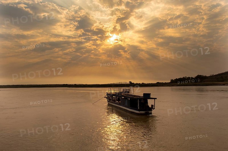 Boat on the Tsiribihina River at sunrise