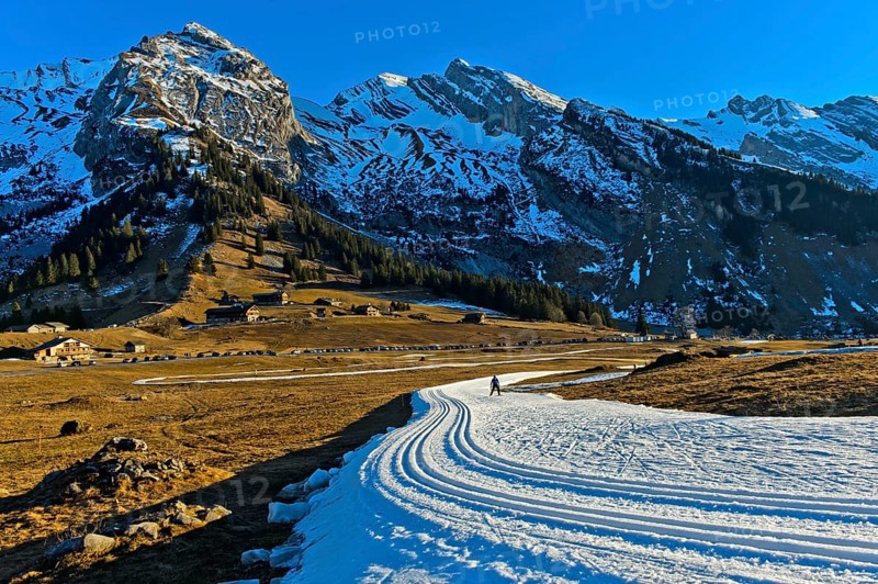 Trail of artificial snow during a snowless winter
