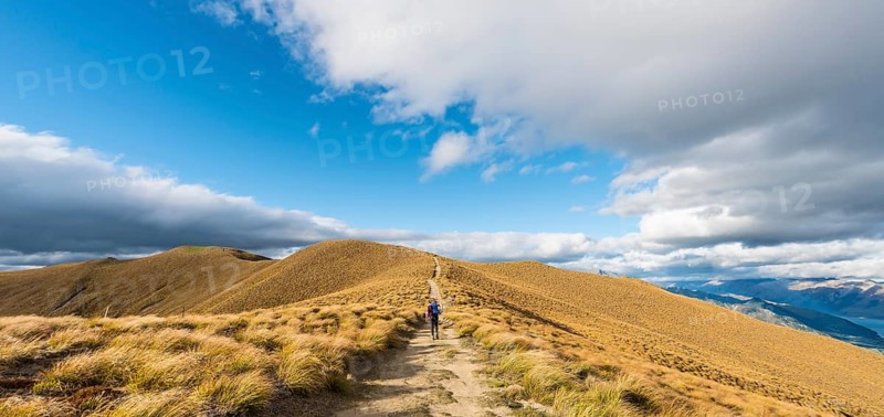 Female hiker on hiking trail to Isthmus Peak