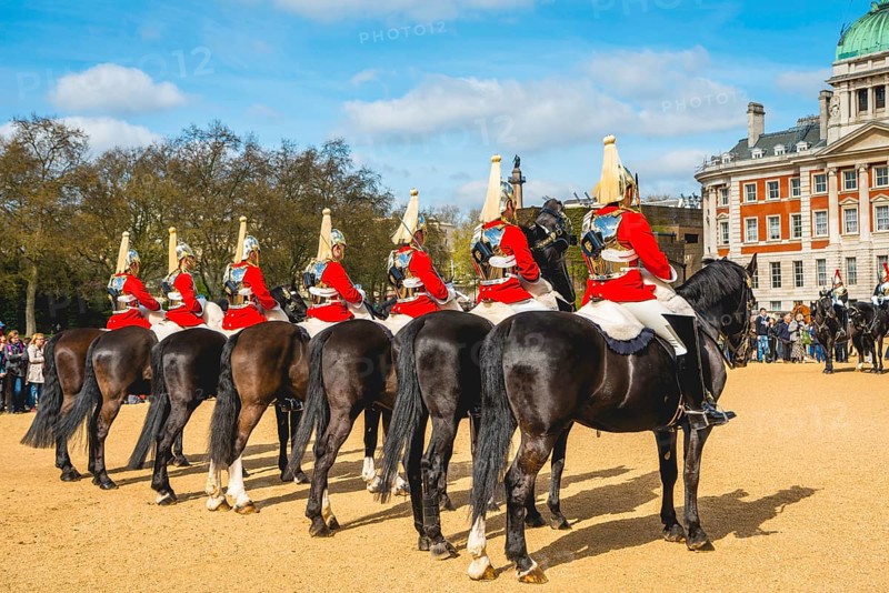 The Royal Guards in red uniform on horses