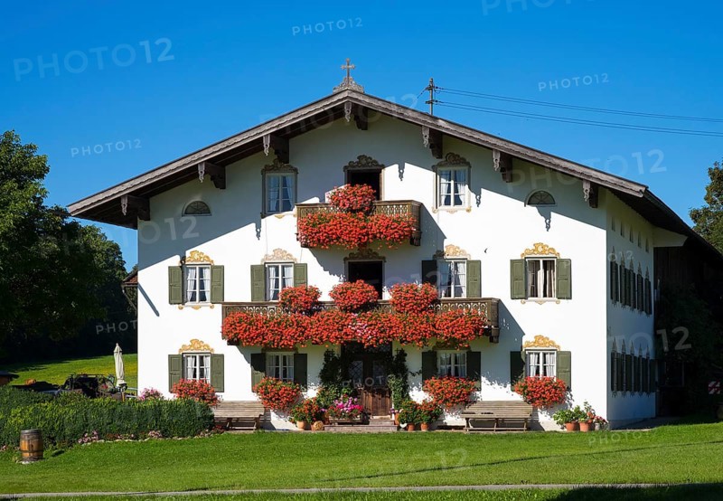Farmhouse with balcony flowers
