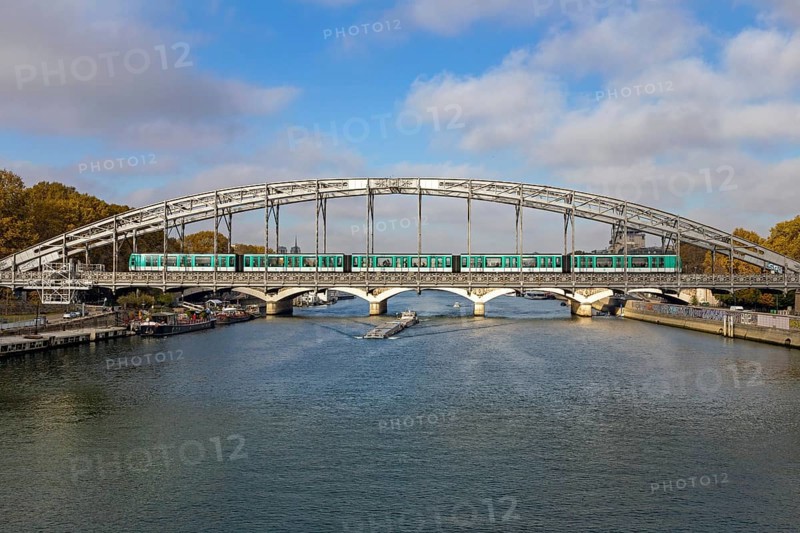 Metro crosses the Seine on steel bridge