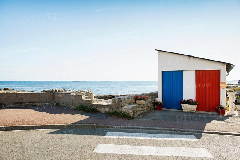 Garage by the sea painted in French national colours