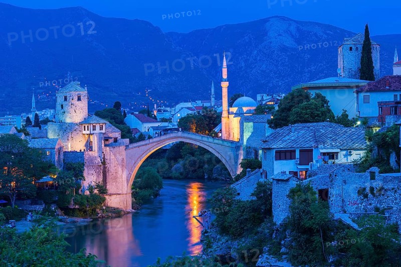 Mostar Bridge over Neretva river at sunset