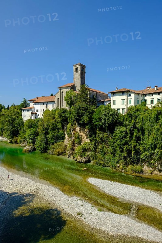 View over the river Natisone to the Campanile of the cathedral Santa Maria Assunta and the old town