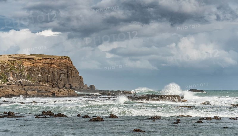 Cliffs and foaming waves