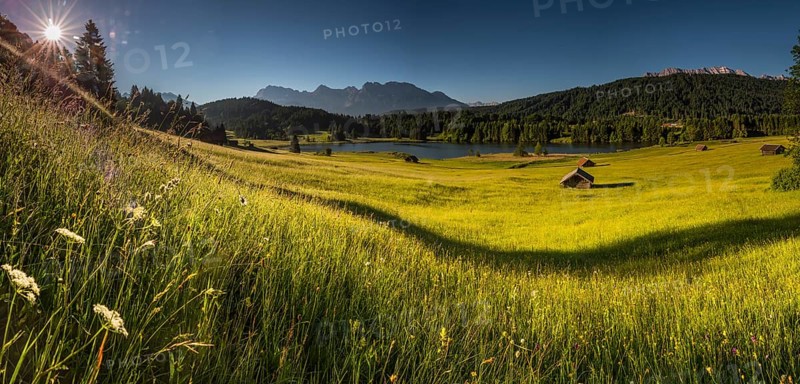 Small cabins on mountain meadow