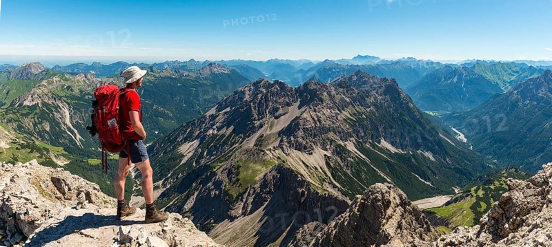Hiker views of mountains and Alps
