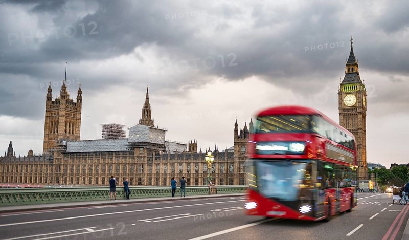 Red double-decker bus on the Westminster Bridge