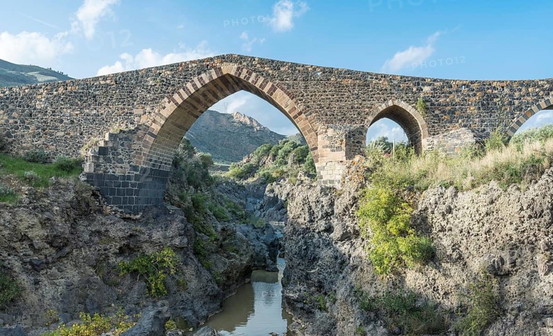 Medieval Saracens bridge crossing the river Simeto