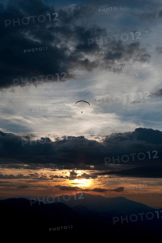 Paraglider flying over Ammertal