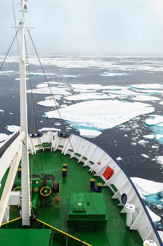 Expedition Boat navigating through melting pack ice