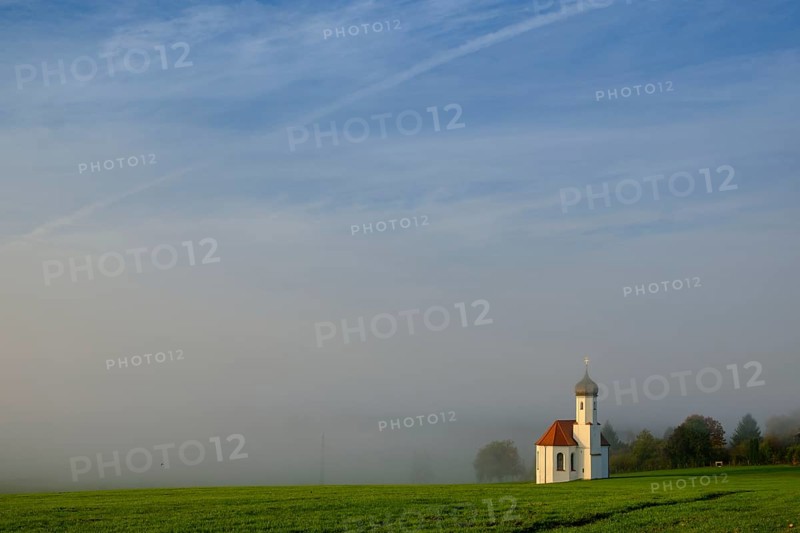 St. Johannisrain near Penzberg in the morning fog of Upper Bavaria