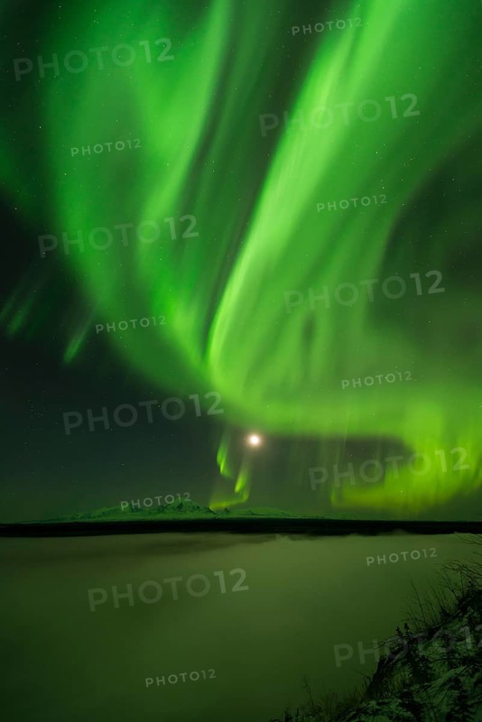 Aurora over the Copper River and the distant peaks of Wrangell Mountains