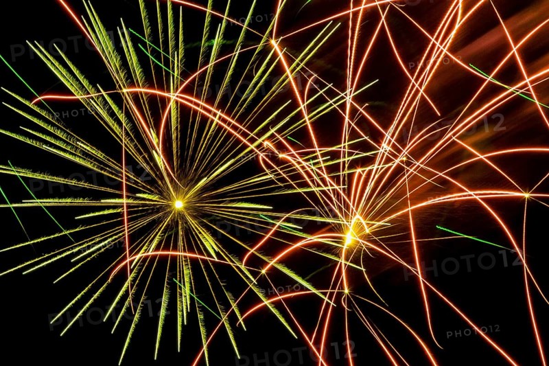 Green and red fireworks in night sky