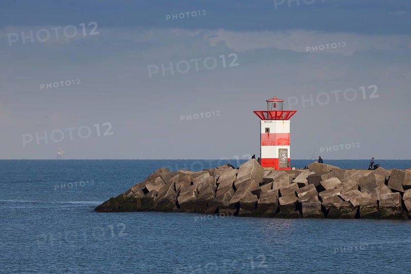 Small lighthouse at harbor entrance