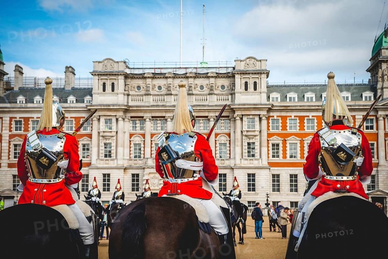 The Royal Guards in red uniform on horses