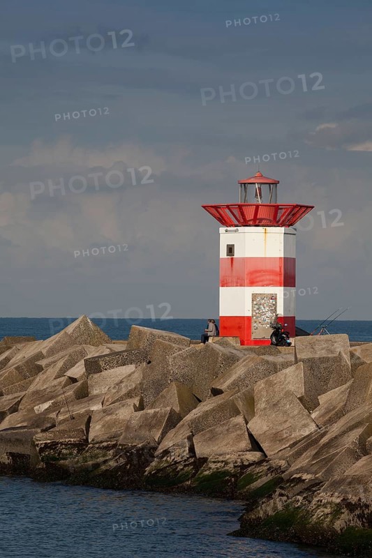 Small lighthouse at harbor entrance