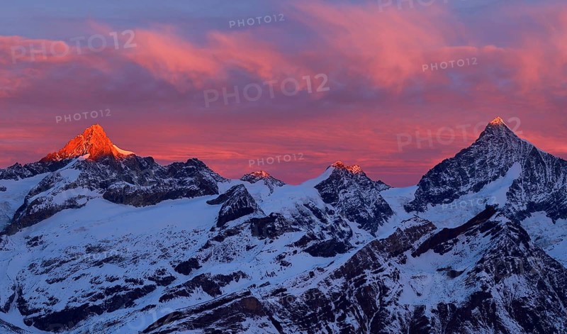 Zinalrothorn with snow in red dawn glow