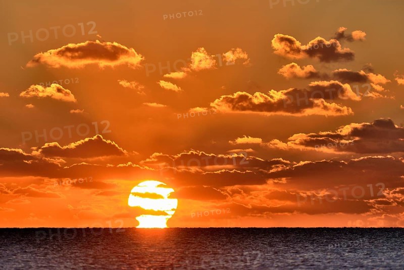 Sunset with cloudy sky above the North Sea