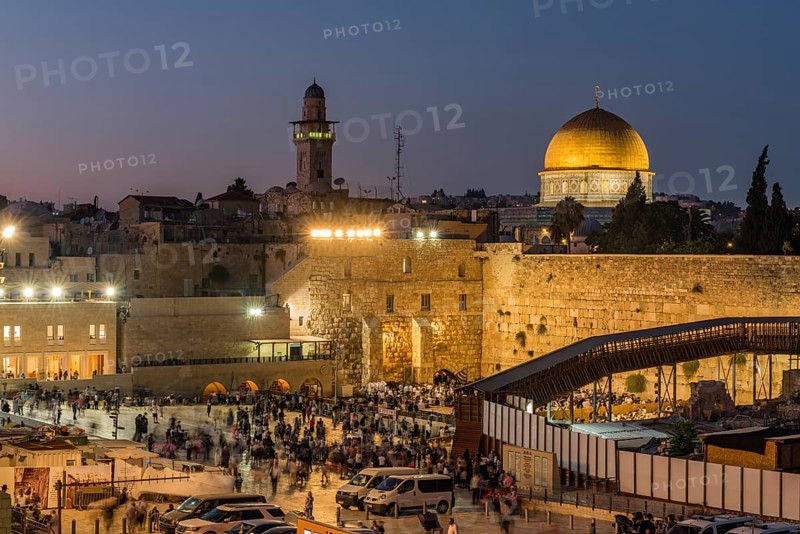 Believers at the Wailing Wall at dusk