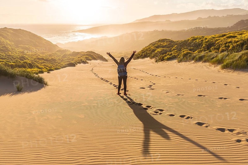 Woman raising arms in the air