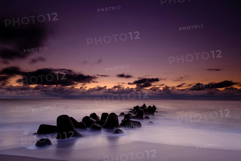 Concrete blocks as coastal protection on the beach of Hornum in the evening light