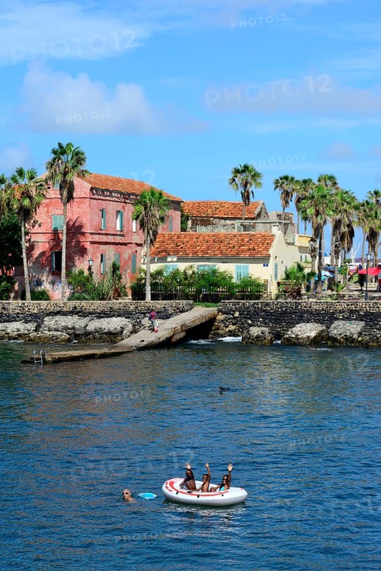 Palm trees and colonial building at the harbor
