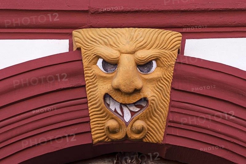 Grotesque above a gate entrance of an old farmstead from 1733