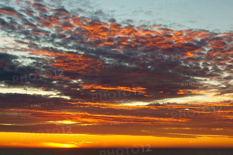 Shining sky over the Pacific Ocean at sunset