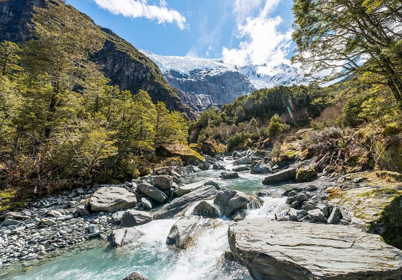 Glacial river flowing through mountains