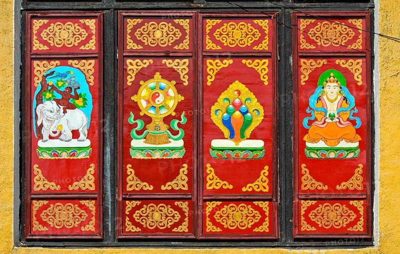 Traditional Buddhist motifs on wall